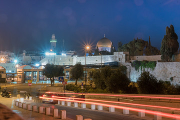 Fototapeta na wymiar Car Light Trails on the road leading to the Western Wall Plaza in the Old City of Jerusalem