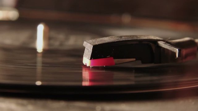 Old record player playing an old dusty vinyl record