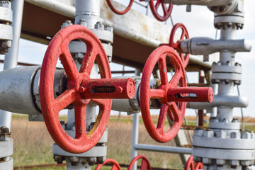 Shut-off valve valve with manual drive. Red steering wheel lock gate valve. oil well equipment