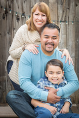 Happy Young Mixed Race Family Portrait Outside.