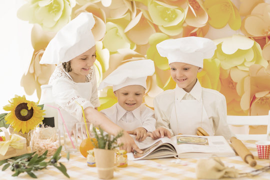 happy little children in the form of a chef to prepare delicious