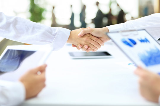 handshake business partners after the conclusion of successful   transaction
