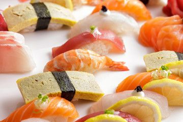 various of nigiri sushi on white plate