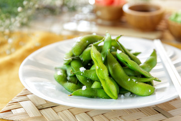 japanese food edamame nibbles, boiled green soy beans