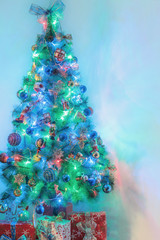 New Year fir tree, gifts, snowman, bokeh