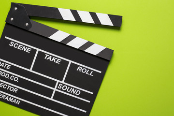 movie clapper on green background