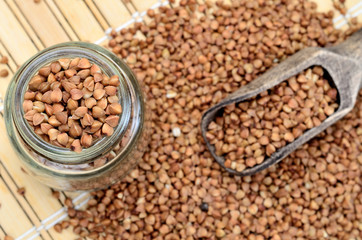 Obraz premium brown buckwheat on table