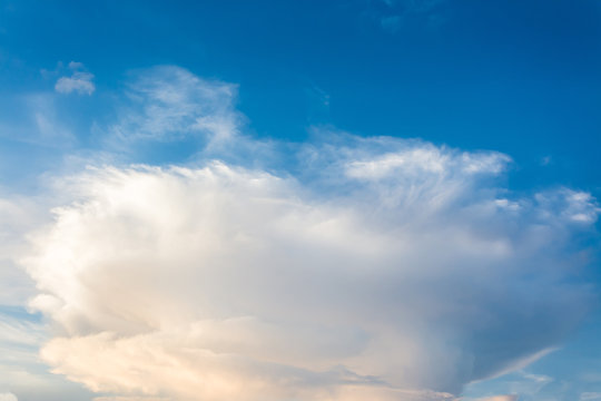 blue sky background with tiny clouds