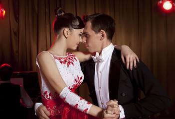 Beautiful couple in the active ballroom dance