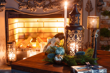 Christmas evening by candlelight. classic apartments with a fireplace,