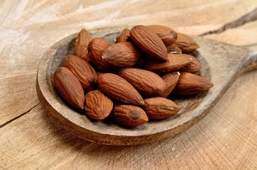 almond in spoon on table