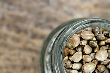 hemp seed in jar on table