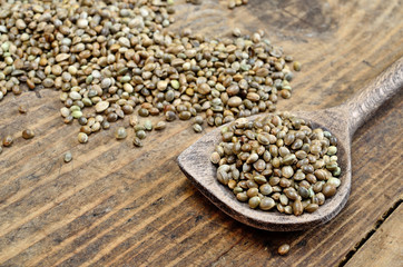 hemp seed in spoon on table