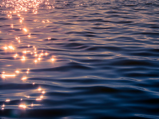hining of sunset reflection on water surface