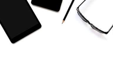 Flat lay photo of office desk with tablet, smartphone, eyeglasses and pencil with copy space background
