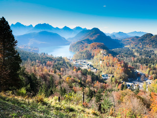 Mountain autumn landscape with colorful forest. Blue sky.