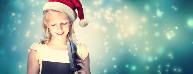Girl with Santa Hat Opening Gift Box