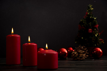 Red candles and christmas tree