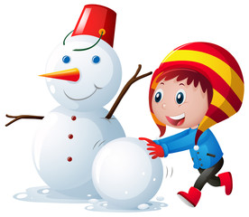 Little kid making snowman