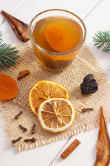 Spruce branches and traditional compote of dried fruits for Christmas