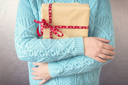 Christmas gifts. Merry christmas. Knitted mittens. Knitted dress. Box with gifts Present. Toned image