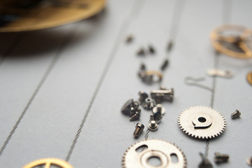 Detail of watch machinery on the table.