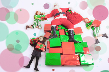 Santa's helpers working at North Pole. He reading wishes list