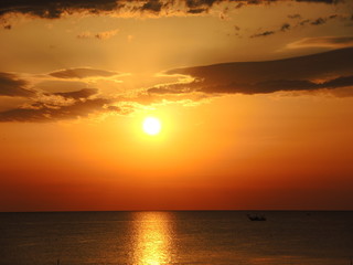 Fishing boats pull their nets at the sunrise. Adriatic cost. Emilia Romagna. Italy.