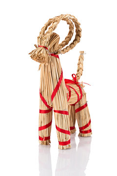 Yule Goat or Christmas goat is a Scandinavian and a Northern European Yule and Christmas symbol and traditional christmas decoration. Viewed from the side. Isolated on white background.