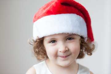 portrait of little cute girls in Santa hat