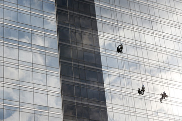 Window cleaners work on skyscraper