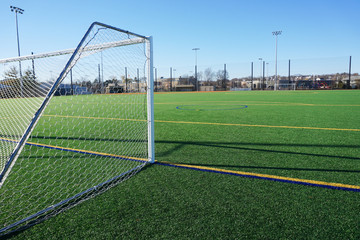 sport field in residential area with artificial green grass