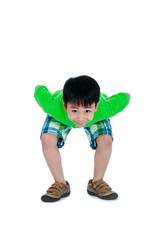 Full body of playful asian child smiling and looking at camera.