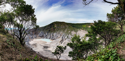 Panoramic view of Tangkuban Perahu crater, showing beautiful and huge mountain crater, at the morning,illuminated by sunlight.  There also a blue sky and beautiful cloud © Adnan
