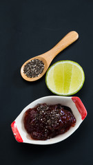 Chia seed, strawberry jam and sliced lime