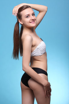 young beautiful girl in black and white bikini