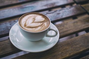 Hot Mocca offee on a wooden table background