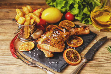 Chicken leg roasted with oranges