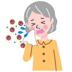 くしゃみをする高齢女性