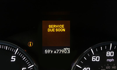 Auto service due soon indicator on dashboard with copy space.