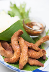 Fried pork,treadition Thai menu set on banana leaf