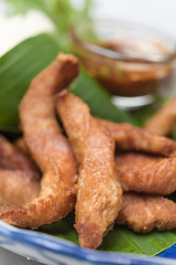 Fried pork,treadition Thai menu set on banana leaf
