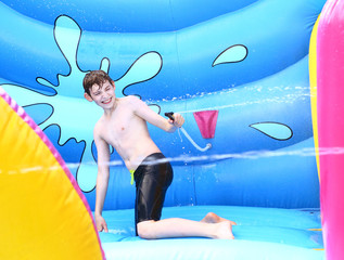 boy enjoy outdoor summer water park