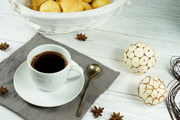 Black coffee in a white cup on a lwhite background 