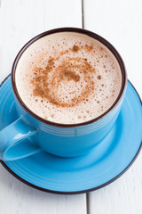 cocoa with cinnamon foam and a top view