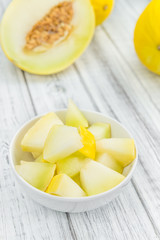 Wooden table with Honeydew Melon (selective focus)