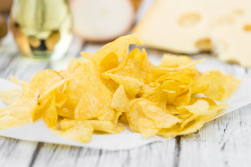 Cheese and Onion Potato Chips (selective focus) on vintage woode