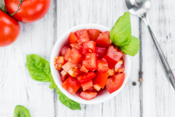 Cutted Tomatoes on vintage wooden background