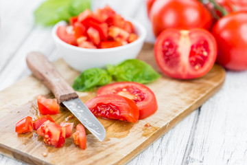 Diced Tomatoes (selective focus) on vintage wooden background