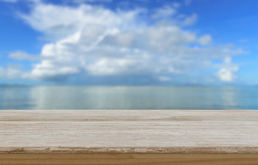 Wood table top with  summer blurred blue beach sky background